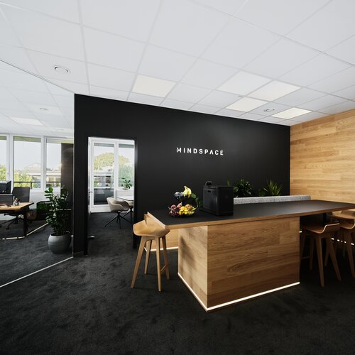 Bar-, Eingangs- und Sozialbereich im Büro der Mindspace GmbH in Wels mit Blick in den Besprechungsraum